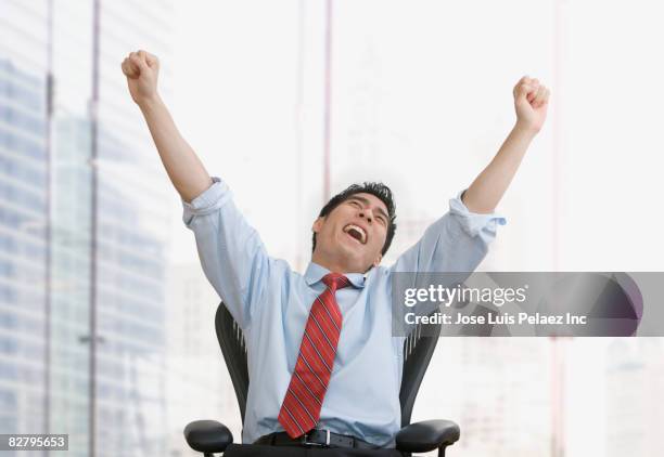 korean businessman celebrating in office - yawn office stock pictures, royalty-free photos & images