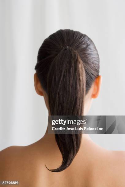 mixed race woman's ponytail - pferdeschwanz stock-fotos und bilder