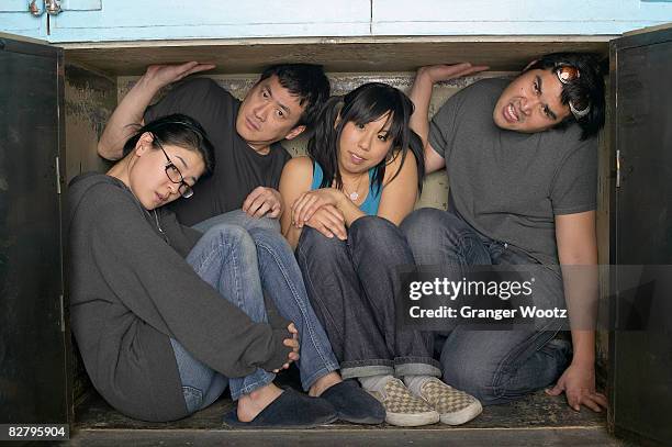 multi-ethnic group squeezed in small space - too small stockfoto's en -beelden