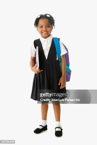 african school girl in uniform holding backpack and notebook - school uniform stock pictures, royalty-free photos & images