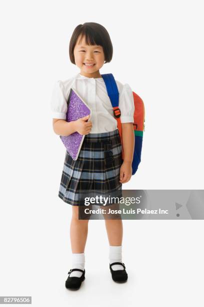 asian school girl in uniform holding backpack and notebook - backpack isolated stock pictures, royalty-free photos & images