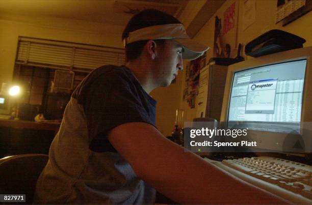 New York University student downloads music from the Napster site March 6, 2001 in New York City. A federal judge has ordered Napster Inc. To block...