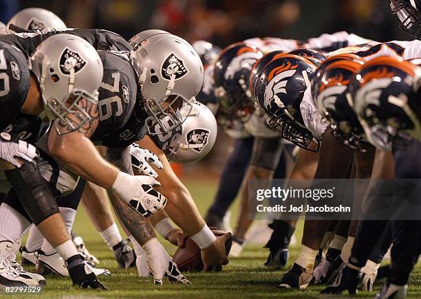 The Denver Broncos defense line up against the Oakland Raiders offense during the NFL game against the Oakland Raiders on September 8, 2008 at McAfee...