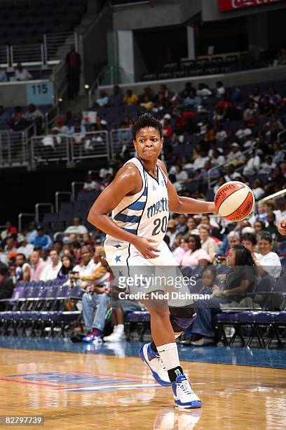 Alana Beard of the Washington Mystics moves the ball against the Detroit Shock during the game at the Verizon Center on September 6, 2008 in...