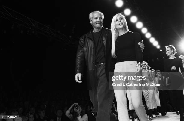 Fashion designers Gianni Versace and Donatella Versace on the runway after a Versace fashion show in March 1996 in New York City, New York.