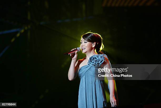 Taiwan singer Winnie Hsin performs during a concert to make the 52nd anniversary of late Hong Kong pop singer and actor Leslie Cheung's birth on...