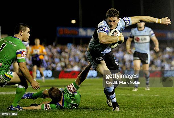 Ben Pomeroy of the Sharks heads for the try line during the second NRL qualifying final match between the Cronulla Sharks and the Canberra Raiders at...