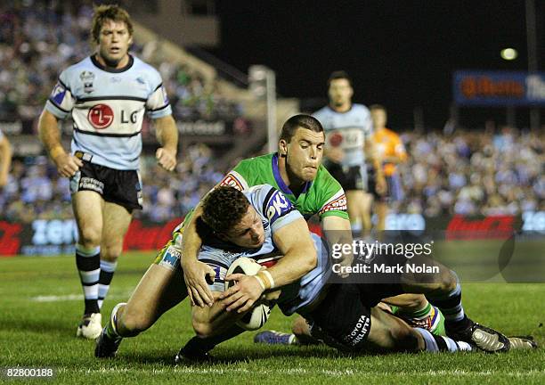 Ben Pomeroy of the Sharks scores a try during the second NRL qualifying final match between the Cronulla Sharks and the Canberra Raiders at Toyota...