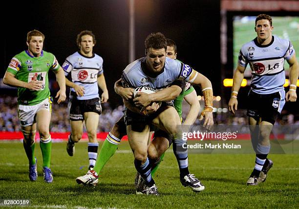 Brett Seymour of the Sharks heads for the try line during the second NRL qualifying final match between the Cronulla Sharks and the Canberra Raiders...