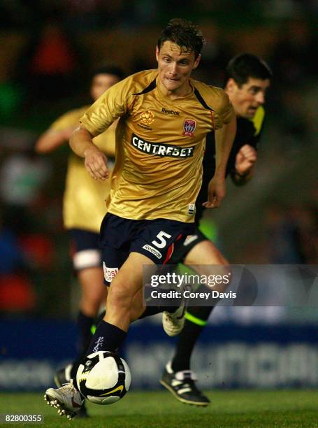 James Holland of the Jets runs with the ball during round four A-League match between the Newcastle Jets and Sydney FC at EnergyAustralia Stadium on...