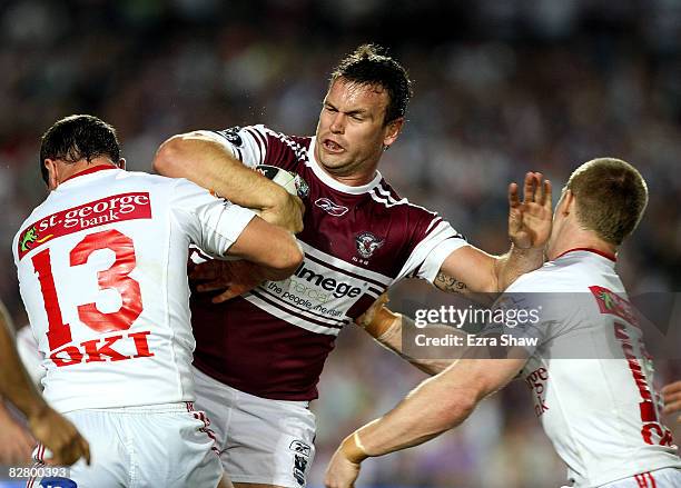 Josh Perry of the Sea Eagles is tackled by the Dragons during the third NRL qualifying final match between the Manly Warringah Sea Eagles and the St...