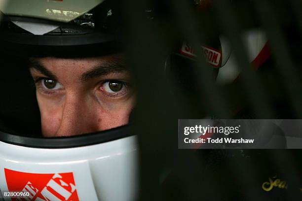 Joey Logano, driver of the Home Depot/DLP HDTV Toyota, prepares to drive during practice for the NASCAR Sprint Cup Series Sylvania 300 at New...