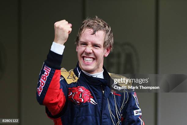 Sebastian Vettel of Germany and Scuderia Toro Rosso celebrates taking pole position after qualifying first for the Italian Formula One Grand Prix at...