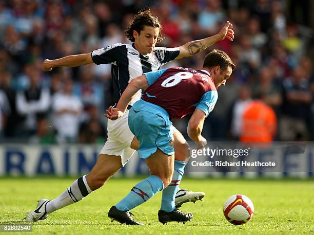 Scott Parker of West Ham challenges Robert Koren of Albion during the Barclays Premier League match between West Bromwich Albion and West Ham United...