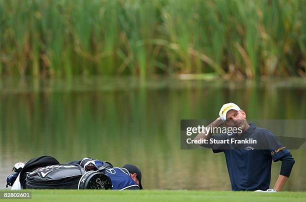 Marcel Siem of Germany ponders on the fifth hole during the third round of The Mercedes-Benz Championship at The Gut Larchenhof Golf Club on...