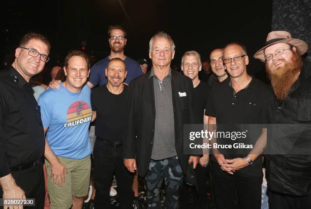 Bill Murray poses with the band backstage at the hit musical based on the 1993 Bill Murray film "Groundhog Day" on Broadway at The August Wilson...