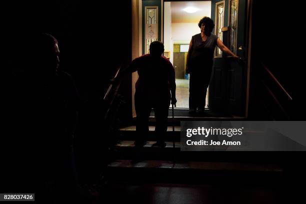 Rosas step father Roberto Obispo and mother Blanca Valdivia leave after one of their frequent visits to the Mancos United Methodist Church fellowship...