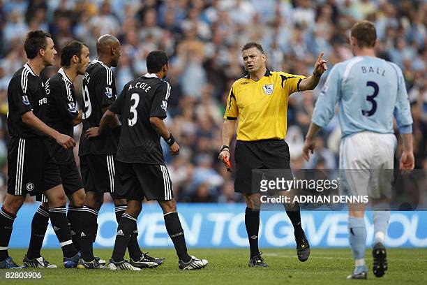 Chelsea players appeal to referee Mark Halsey after he sent off Chelsea's English defender John Terry after a tackle on Manchester City's Brazilian...