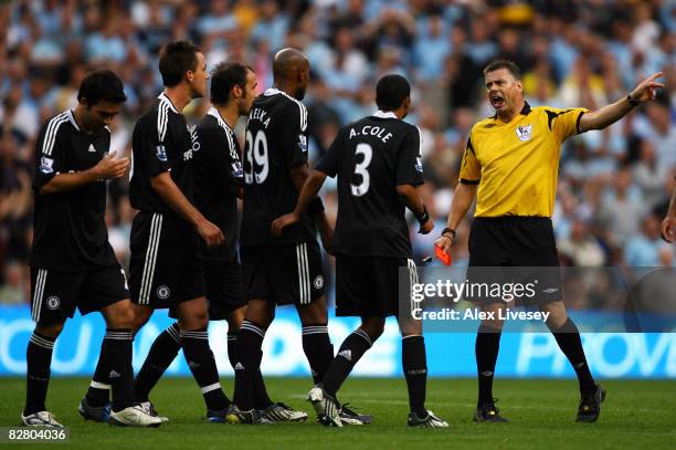 Chelsea players appeal in vain after referee Mark Halsey shows John Terry of Chelsea a red card during the Barclays Premier League match between...