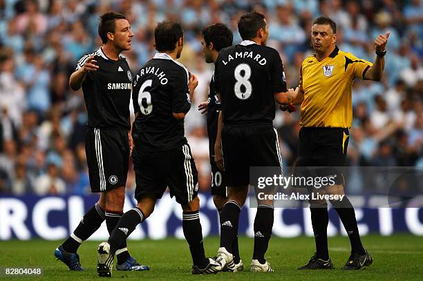 Chelsea players appeal in vain after referee Mark Halsey shows John Terry of Chelsea a red card during the Barclays Premier League match between...