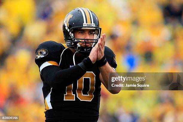 Quarterback Chase Daniel of the Missouri Tigers applaudes after passing for a touchdown during the first half of the game against the Nevada Wolf...