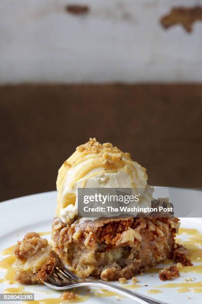 Apple Cake a la Mode, Our Mom's specialty apple crumble cake served with vanilla ice cream at Our Mom Eugenia photographed in Great Falls, VA. .