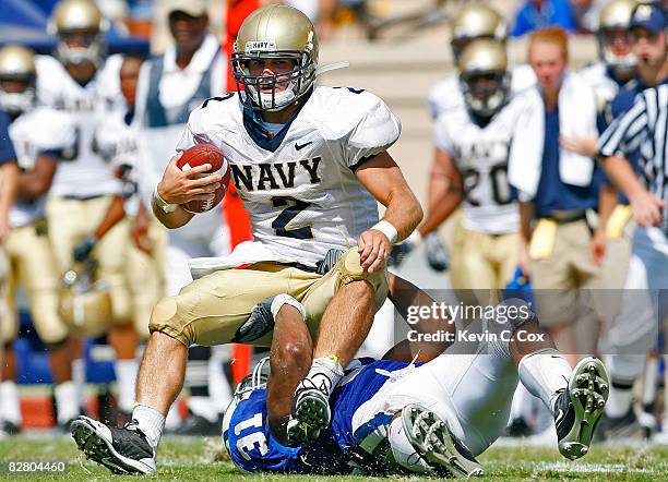 Vincent Rey of the Duke Blue Devils sacks quarterback Jarod Bryant of the Navy Midshipmen during the game at Wallace Wade Stadium on September 13,...