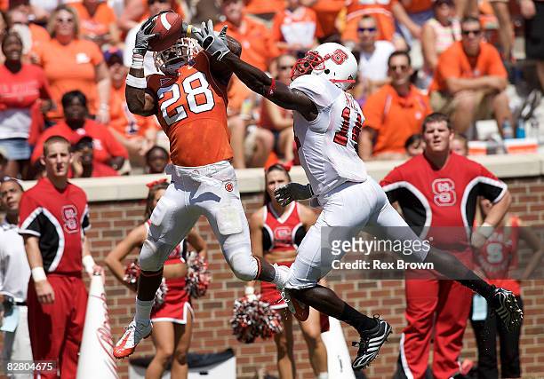Spiller of the Clemson Tigers pulls down this pass for a touchdown as he is defended by J.C. Neal of the North Carolina State Wolfpack during the...