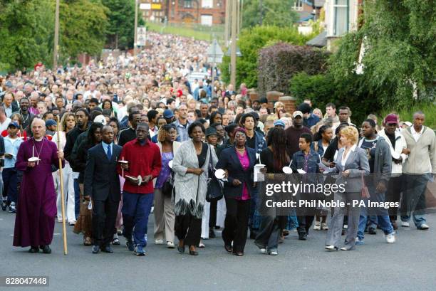 Hundreds of members of the public along with the family of murdered Anthony Walker, take part in a candlelit procession will to the spot where the...