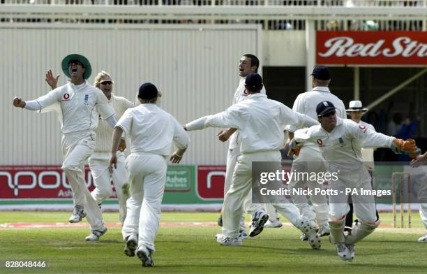 England players celebrate after Steve Harmison takes the last wicket of Australia's Michael Kasprowicz caught behind by wicketkeeper Geraint Jones...