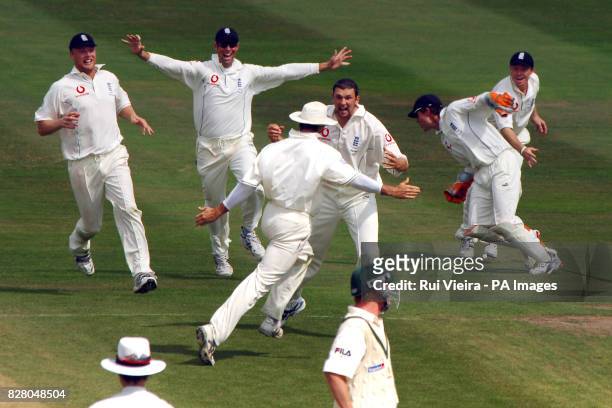 England's Steve Harmison celebrates with team-mates after taking the last wicket of Australia's Michael Kasprowicz caught behind by wicketkeeper...