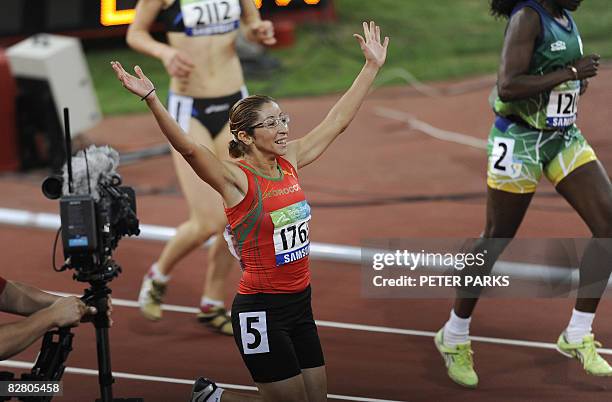 Sanaa Benhama of Morocco celebrates winning gold in the women's 200m T13 final during the 2008 Beijing Paralympic Games at the National Stadium in...