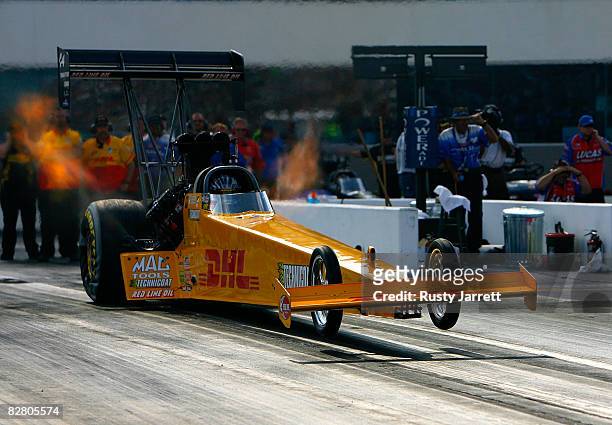 Dave Grubnic, driver of the DHL top fuel dragster leaves during qualifying for the NHRA Carolinas Nationals at the Zmax Dragway on September 13, 2008...