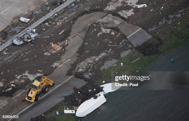 In this aerial photo, A bulldozer clears debris along Interstate 45 after Hurricane Ike made landfall September 13, 2008 in Galveston, Texas. Ike...