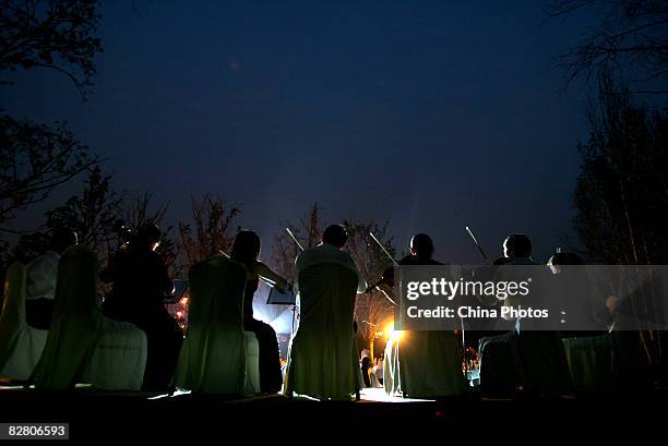 Band of musicians perform during an evening to mark the Mid-Autumn Festival on September 13, 2008 in Xian of Shaanxi Province, China. The Mid-Autumn...