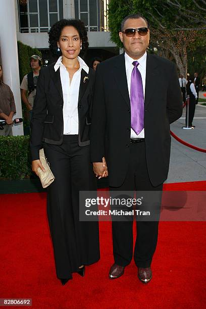 Actor Laurence Fishburne and actress Gina Torres arrive to the star-studded gala for the re-opening of the Mark Taper Forum hosted by Dame Edna on...