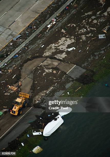 In this aerial photo, crews work to clear debris on Interstate 45 headed toward Galveston Island after the passing of Hurricane IkeSeptember 13, 2008...