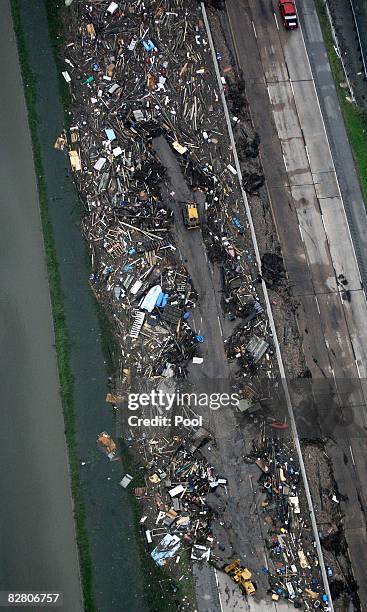 In this aerial photo, bulldozers clear debris from Hurricane Ike along Interstate 45 September 13, 2008 in Galveston, Texas. Ike caused extensive...