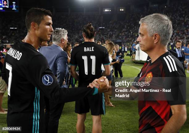 Cristiano Ronaldo of Real Madrid shakes hands with head coach Jose Mourinho of Manchester United after the UEFA Super Cup match between Real Madrid...