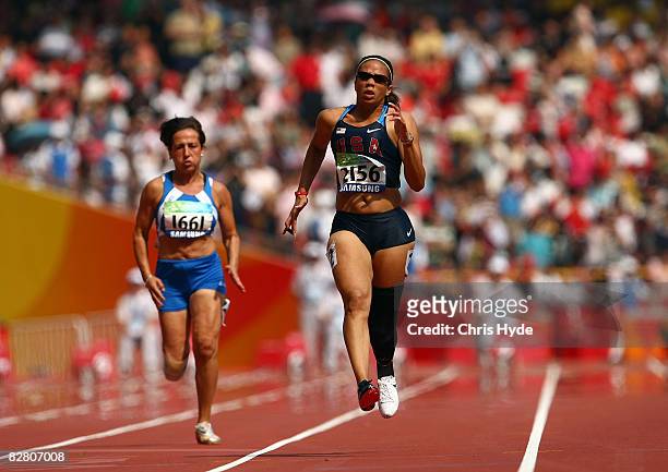 April Holmes of the United States competes in the Women's 100m-T44 Athletics event at the National Stadium during day eight of the 2008 Paralympic...
