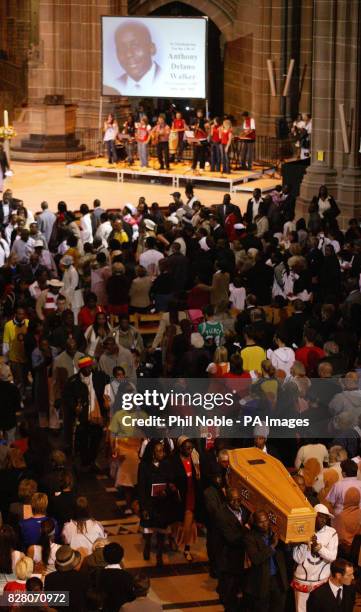 Family members follow the coffin of murdered teenager Anthony Walker as it is carried from Liverpool Cathedral following his funeral Thursday August...