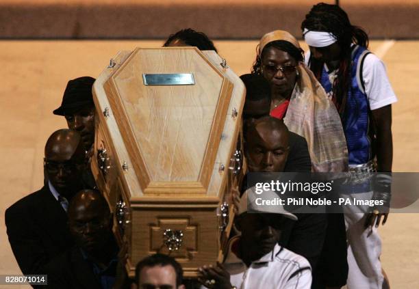 Gee, the mother of murdered teenager Anthony Walker follows his coffin as it is carried from Liverpool Cathedral following his funeral Thursday...