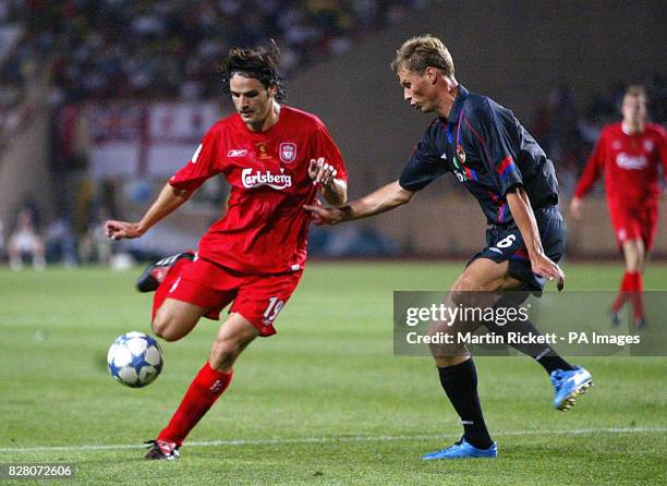 Liverpool's Fernando Morientes battles with CSKA Moscow's Alexey Berezutskiy for the ball during the UEFA Super Cup match at the Louis II Stadium in...