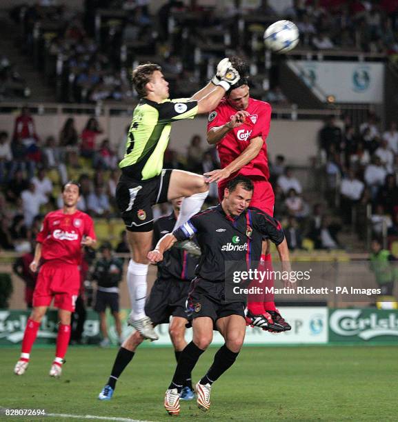 Liverpool's Fernando Morientes battles with CSKA Moscow goalkeeper Igor Akinfeev and Sergey Berezutskiy for the ball during the UEFA Super Cup match...