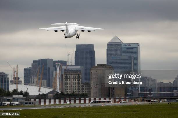 Passenger aircraft, operated by CityJet Ltd., takes off towards the Canary Wharf financial, business and shopping district at London City Airport ,...