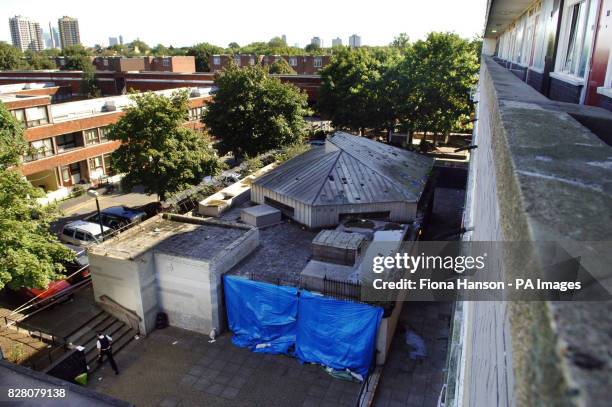 The Wood Dene Community Centre, Peckham, south east London Monday August 29, 2005 is shielded by blue plastic sheeting and cordoned off by police...