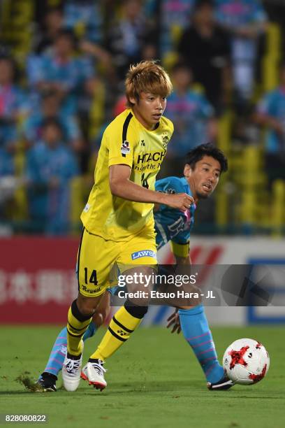 Junya Ito of Kashiwa Reysol and Yoshiki Takahashi of Sagan Tosu during the J.League J1 match between Kashiwa Reysol and Sagan Tosu at Hitachi Kashiwa...