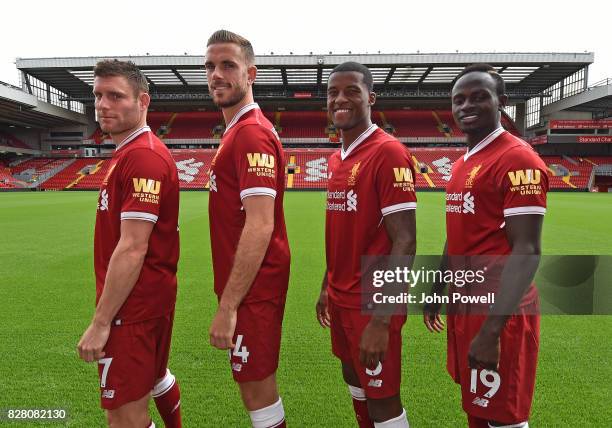 For the Launch of the Western Union partnership James Milner, Jordan Henderson, Georginio Wijnaldum and Sadio Mane of Liverpool wear the shirts with...
