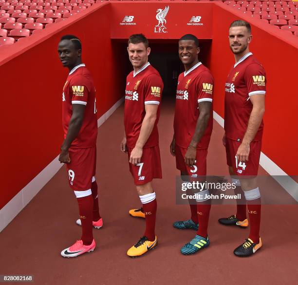 For the Launch of the Western Union partnership Sadio Mane, James Milner, Georginio Wijnaldum and Jordan Henderson of Liverpool wear the shirts with...