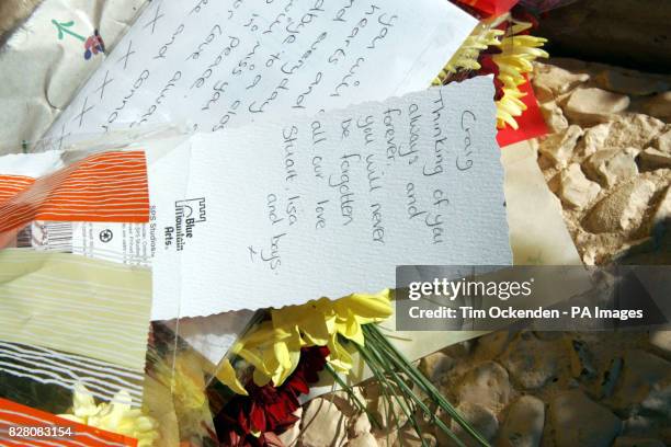 Flowers and notes are left outside 11 Laburnum Close, Ambrosden, Tuesday August 30 2005. Police investigating the deaths of three people involved in...